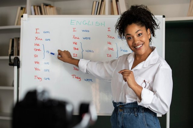 medium-shot-smiley-woman-teaching_23-2149272223.jpg