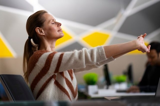 woman-office-stretching-during-w.jpg