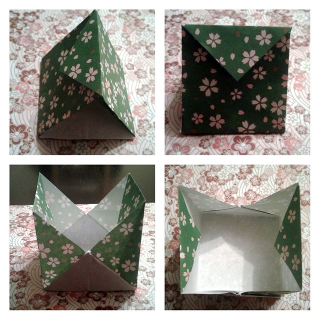 Origami bird carrying a festive gift bag