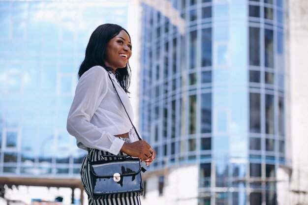 african-american-woman-outdoors-by-skyscraper_1303-10901.jpg