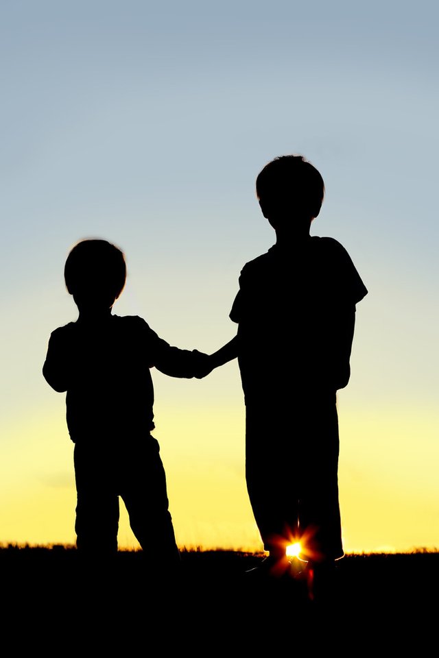 stock-photo-silhouette-young-children-holding-hands.jpg