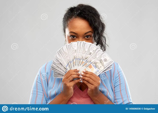 people-finances-wealth-concept-excited-african-american-young-woman-hiding-her-face-behind-fan-dollar-money-over-grey-145606030.jpg