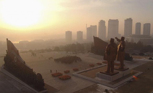 Statues of North Korea's founder Kim Il Sung and former leader Kim Jong Il at Mansudae hill in Pyongyang in this undated photo released January 1, 2014. REUTERS.KCNA.jpg