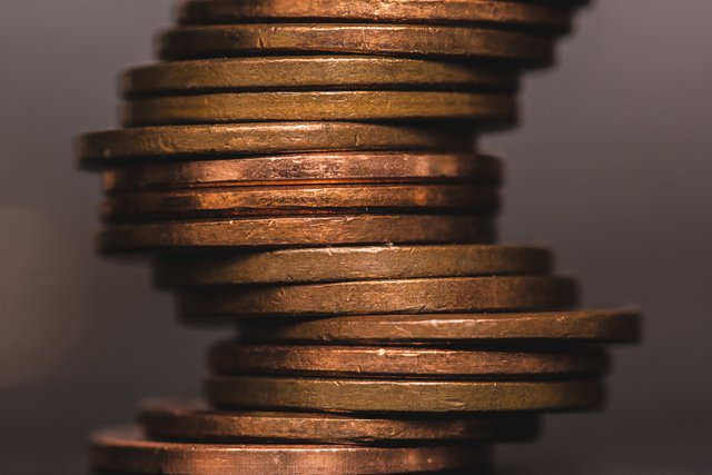 coins-stacked-in-crooked-pile_4460x4460.jpg
