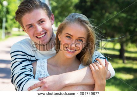 stock-photo-portrait-of-a-happy-couple-laughing-at-camera-204749977.jpg