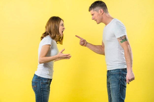 young-couple-standing-face-face-arguing-with-each-other-against-yellow-background_23-2148056182.jpg