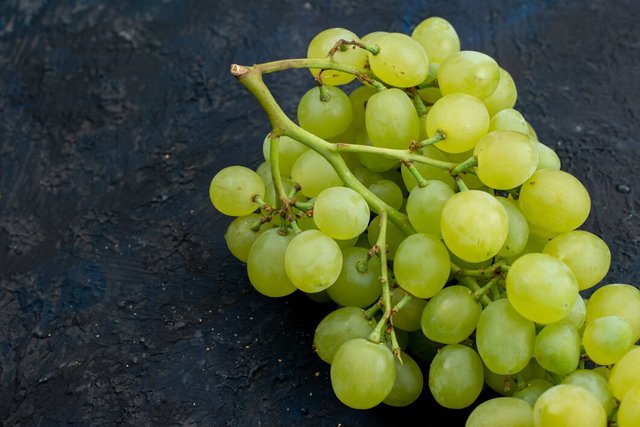 top-view-fresh-green-grapes-sour-juicy-mellow-dark-background-fruit-ripe-plant_140725-22727.jpg