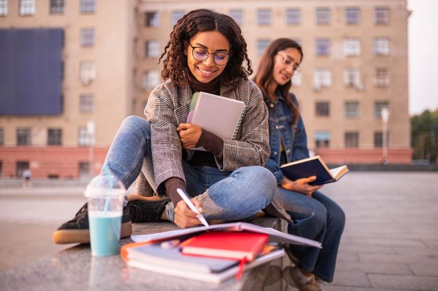 smiley-friends-doing-homework-outdoors.jpg