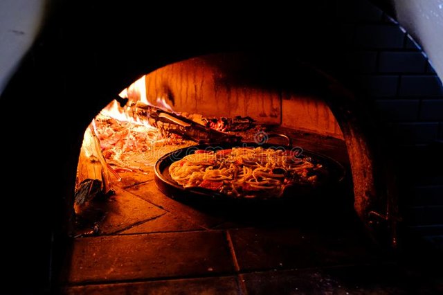 brick-oven-hot-homemade-pizza-cooking-inside-110153761.jpg