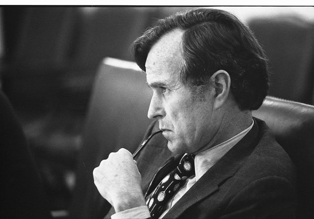 CIA_Director_George_H.W._Bush_listens_at_a_meeting_following_the_assassinations_in_Beirut,_1976_-_NARA_-_7064954.jpg
