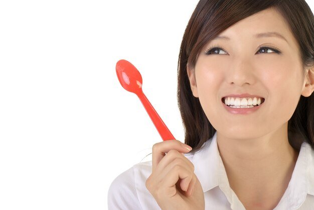 happy-businesswoman-holding-tablespoon-closeup-portrait-oriental-office-lady_320880-86.jpg