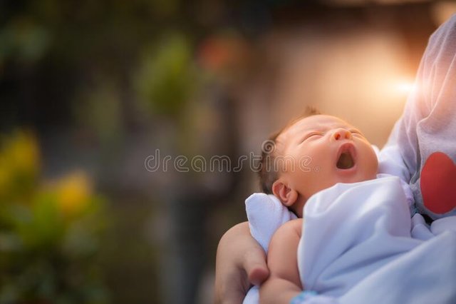 new-born-baby-boy-resting-mothers-arms-190089657.jpg