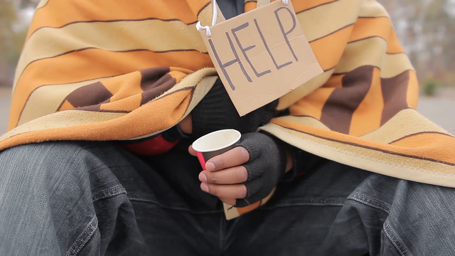 poor-man-holding-out-hand-with-paper-cup-to-camera-asking-for-help-and-charity_r6jhvqd7__F0000.png