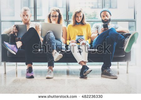 stock-photo-group-adult-hipsters-friends-sitting-sofa-using-modern-gadgets-business-startup-friendship-teamwork-482236330.jpg