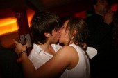 couple-kissing-in-a-nightclub-picture-id175226109.jpg