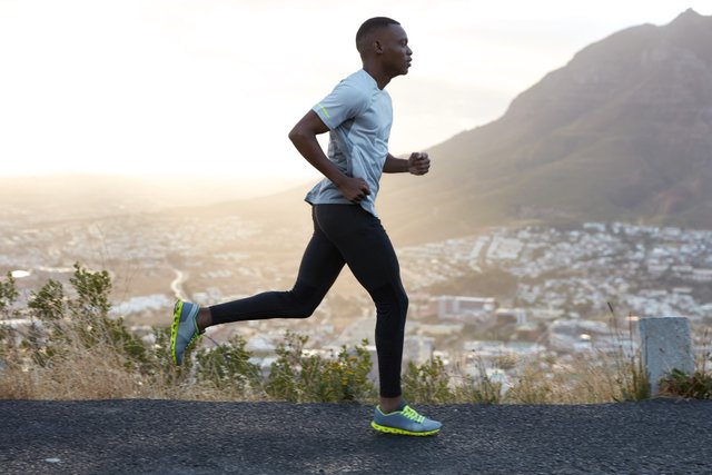 outdoor-shot-active-dark-skinned-man-running-morning-has-regular-trainings-dressed-tracksuit-comfortable-sneakers-concentrated-into-distance-sees-finish-far-away.jpg