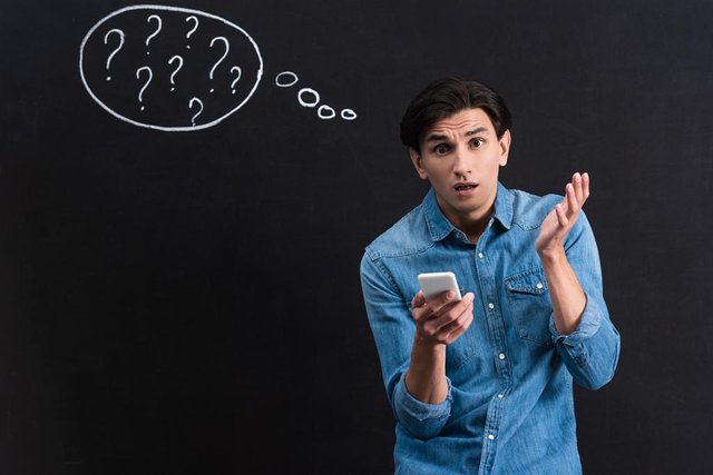 stock-photo-shocked-young-man-using-smartphone.jpg