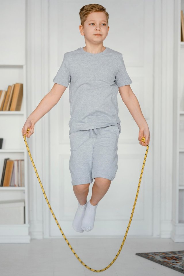 full-shot-boy-jumping-rope-indoors_23-2148866149.jpg