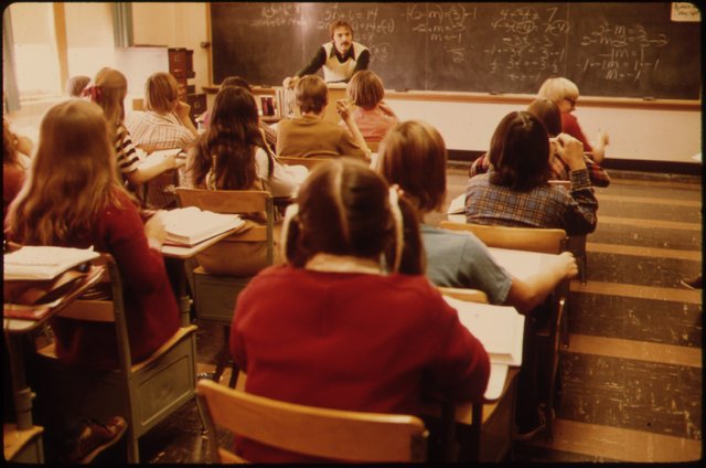STUDENTS_AND_TEACHER_IN_A_CLASSROOM_AT_CATHEDRAL_HIGH_SCHOOL_IN_NEW_ULM,_MINNESOTA._THE_TOWN_IS_A_COUNTY_SEAT_TRADING..._-_NARA_-_558214.jpg