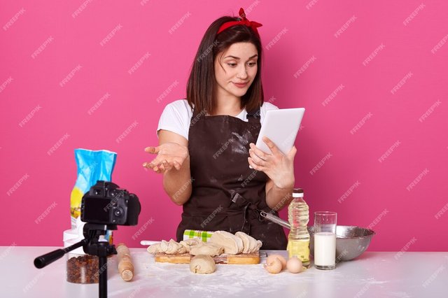 attentive-thoughtful-brunette-with-red-headband-looking-tablet-screen_176532-7632.jpg