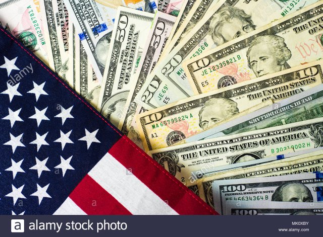 american-flag-and-banknotes-usd-currency-money-MK0XBY.jpg