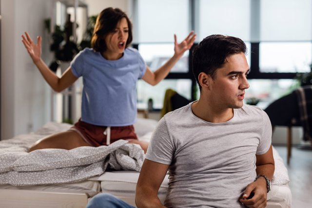 young-couple-having-fight-bedroom-man-is-ignoring-his-girlfriend-who-is-yelling-him-background.jpg