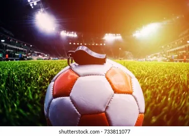 football-ball-whistle-on-grass-260nw-733811077.webp