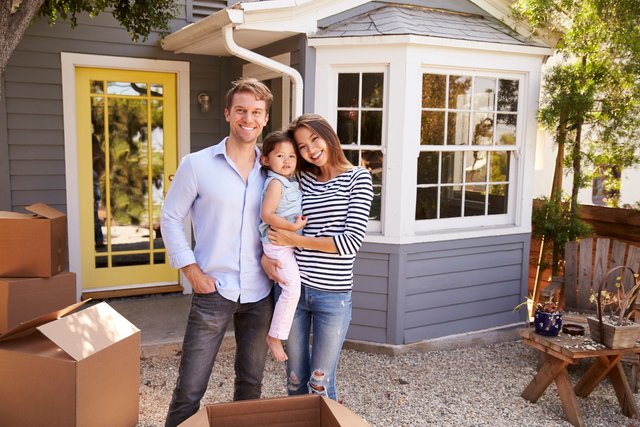 Couple in front of a new house