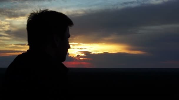 depositphotos_109714682-stock-video-male-silhouette-at-sunset-man.jpg