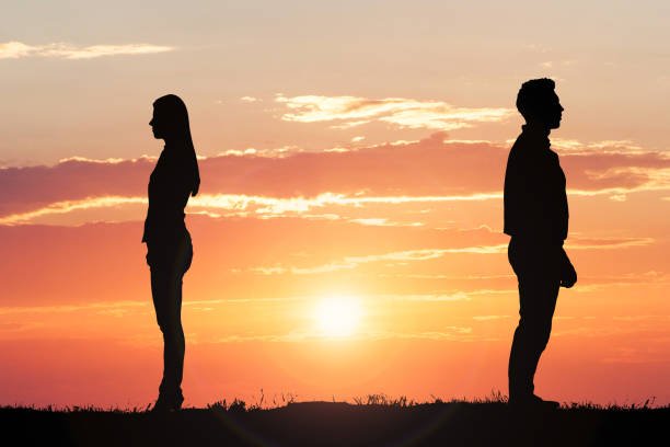 couple-silhouette-standing-away-from-each-other.jpg