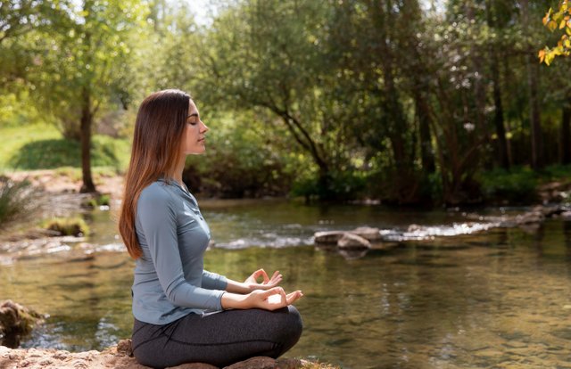 beautiful-woman-meditating-nature.jpg