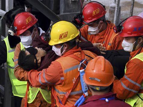 China rescues 11 miners trapped for two weeks after underground explosion.jpg