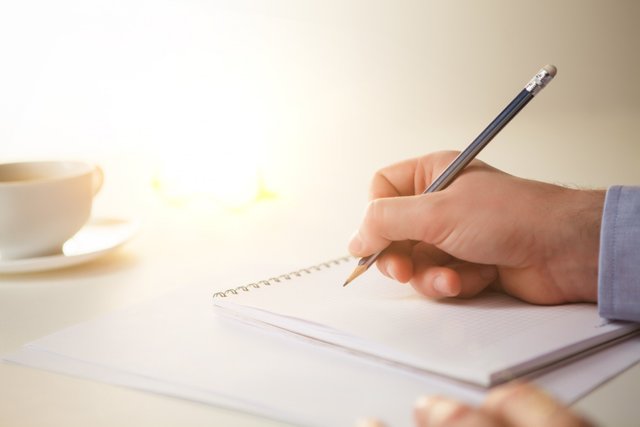 male-hand-with-pencil-cup.jpg