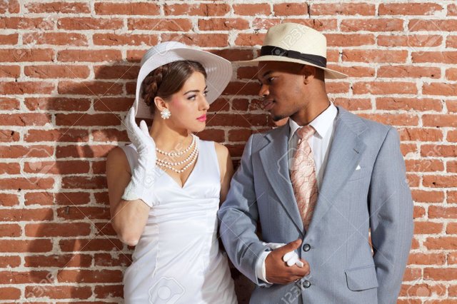 20692622-vintage-jazz-fashion-sexy-wedding-couple-in-old-urban-building-mixed-race-wearing-a-hat-.jpg