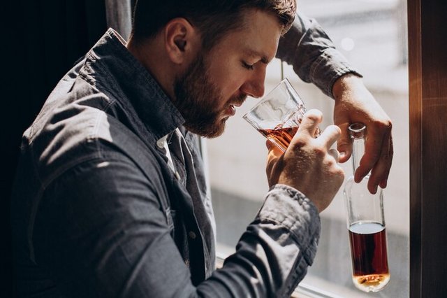 man-drinker-depressed-with-bottle-whiskey_1303-28170.jpg