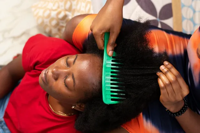 stylist-woman-taking-care-her-client-afro-hair_23-2149259397.webp
