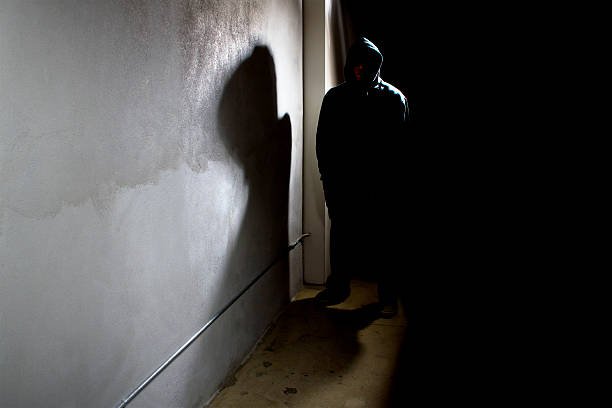stalker-in-a-dark-alley-picture-id479243646.jpg