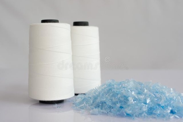 pet-bottle-flake-plastic-crushed-raw-white-polyester-fdy-yarn-spool-background-186539936.jpg