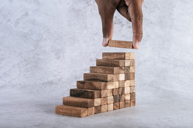 stacking-wooden-blocks-is-risk-creating-business-growth-ideas_1150-19611.jpg