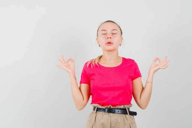 young-woman-t-shirt-pants-doing-meditation-with-closed-eyes-looking-relaxed_176474-37046.jpg