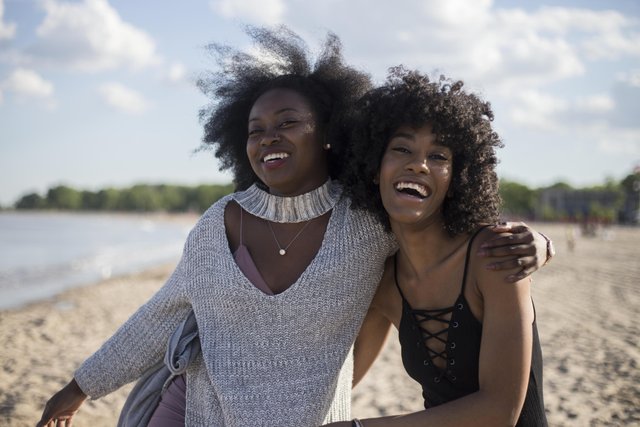 friends-laughing-on-beach.jpg