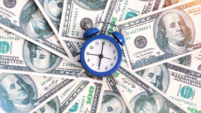 layer-money-with-clock-center-finance-idea.jpg