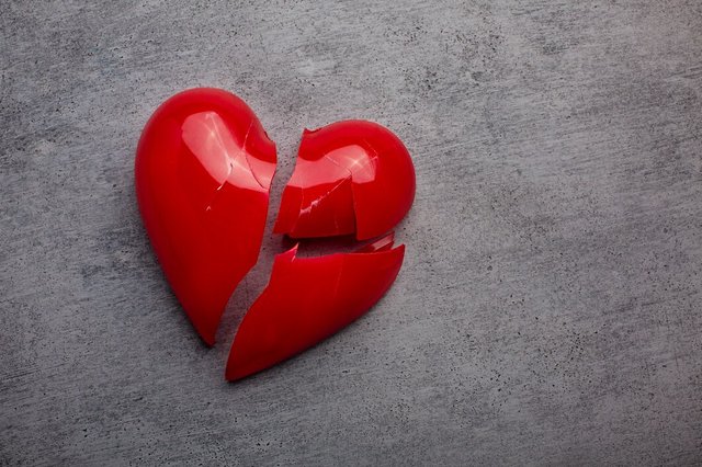 broken-plastic-red-heart-grey-background_23-2149415879.jpg