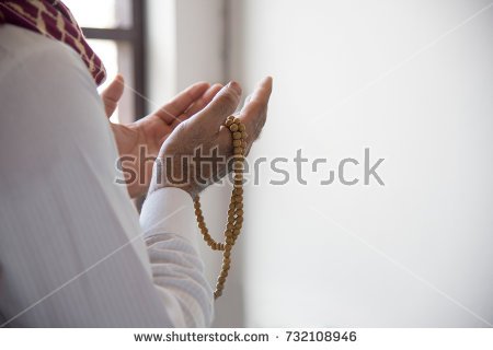 stock-photo-religious-muslim-man-praying-inside-the-mosque-732108946.jpg