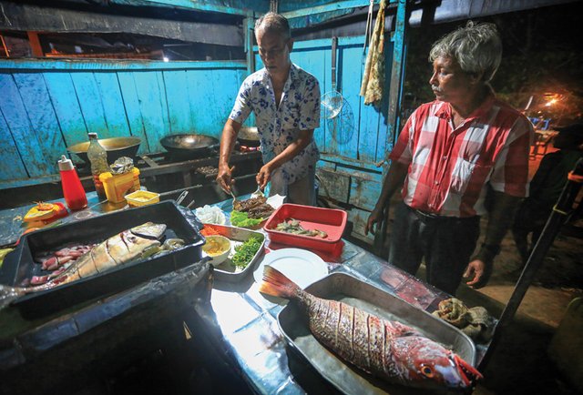 The make-shift kitchen is where the ingredients are mixed and the prepared grills are garnished.jpg