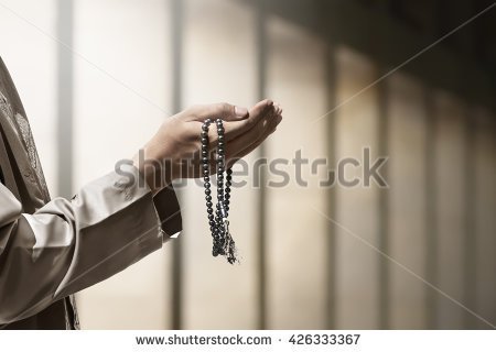 stock-photo-hand-of-muslim-people-praying-with-mosque-interior-background-426333367(2).jpg