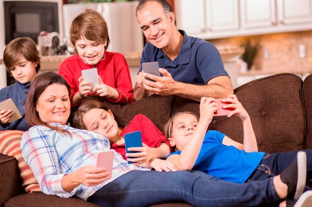 PROD-Family-all-using-mobile-phones.jpg