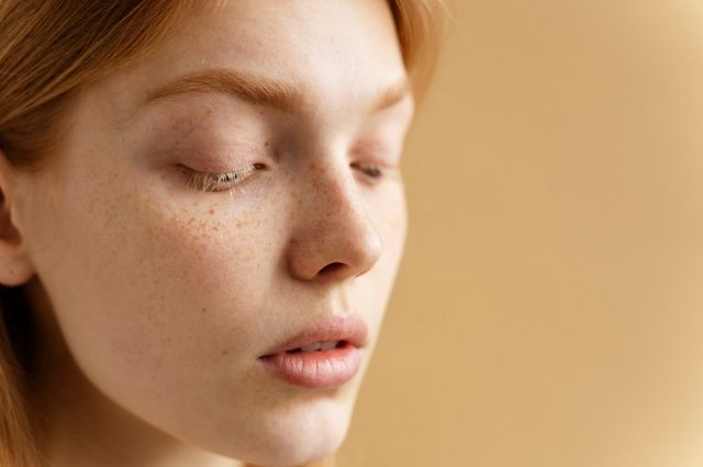 young-woman-with-freckles-close.jpg