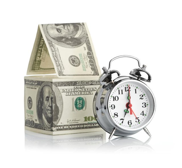 house-made-dollars-alarm-clock-isolated-white-background-35493662.jpg