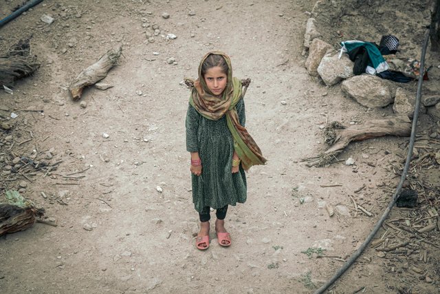 free-photo-of-high-angle-view-of-a-girl-wearing-green-clothing-standing-on-the-dust.jpeg